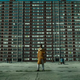 Michael Hargrove as Sherman Fields stands before a towering Cabrini Green building.